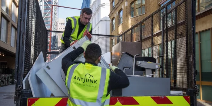 anyjunk man and van carrying waste into van
