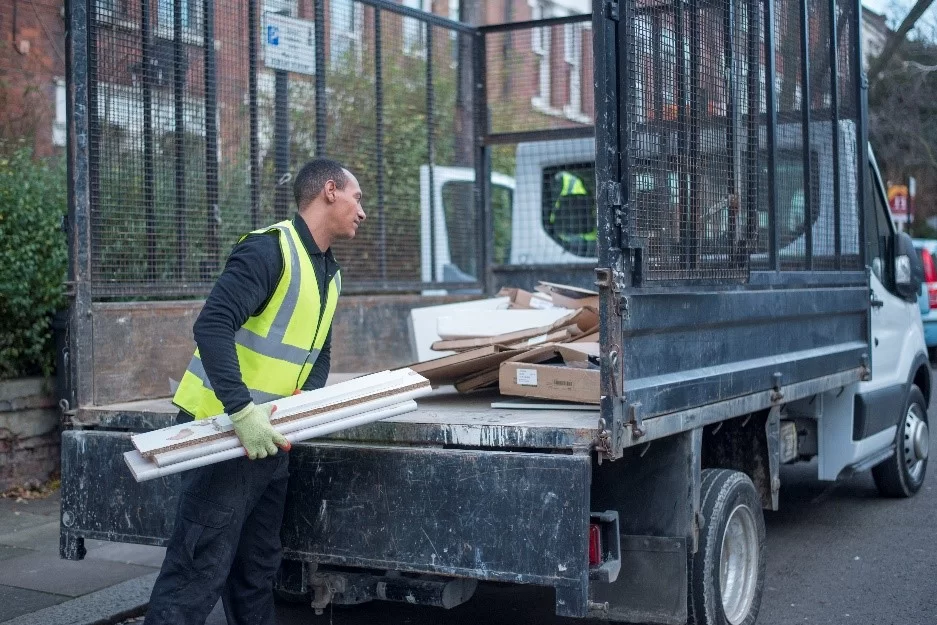 man and van with planks of wood